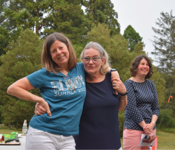 Judy Masi (L) in the courtyard of Blandy's historic Quarters Building, 2023. 