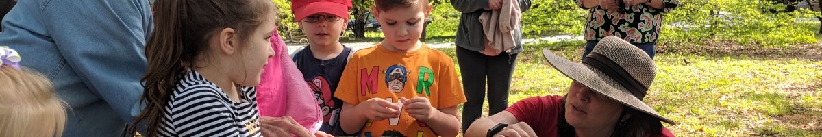 Preschool children explore color in nature outside